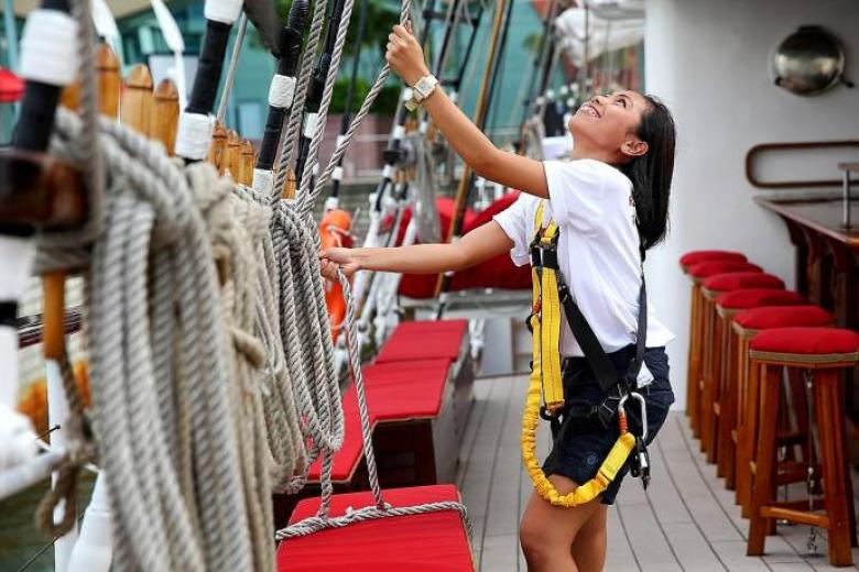 woman pulling a rope on royal albatross