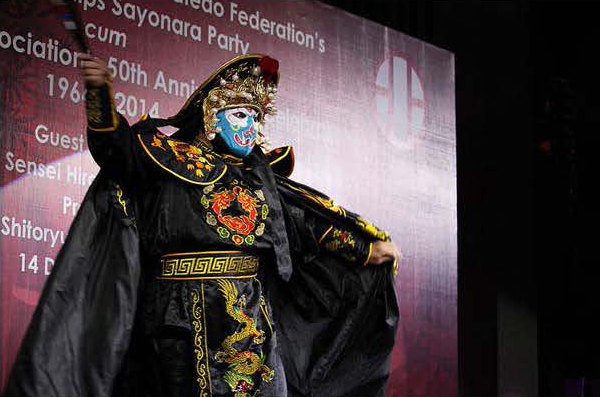 man performing in traditional costume with mask royal albatross