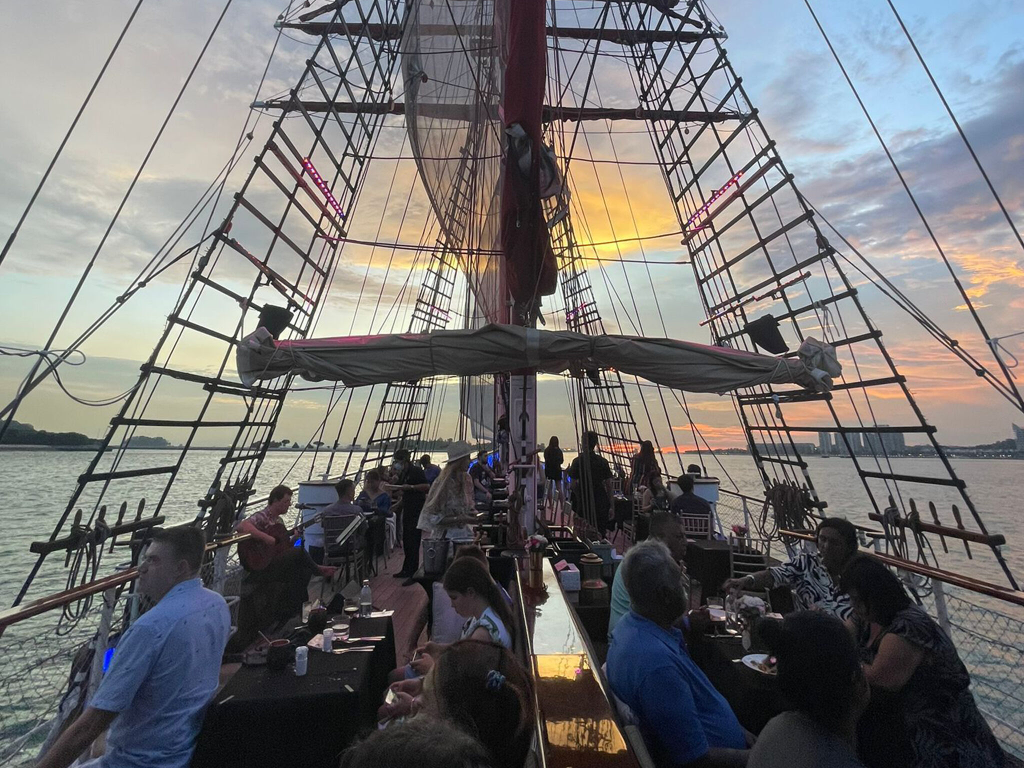 Couples enjoying romantic dining experience on Royal Albatross cruise under the stars for SG60 National Day celebration